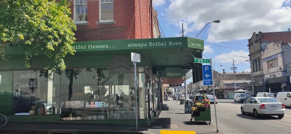 Flowers by Tribal Rose shopfront on Smith Street, Fitzroy — deep green fascia reading 'always Tribal Rose, est. 1998'